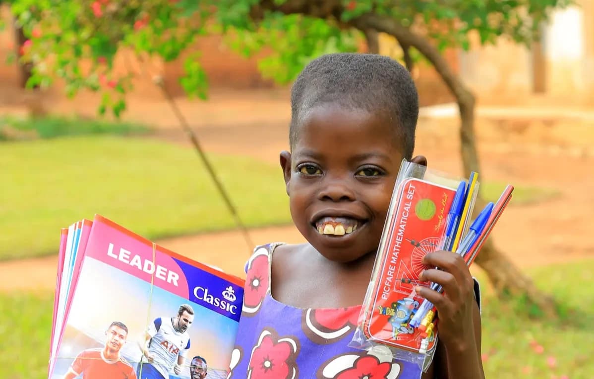Bridget smiling with textbooks