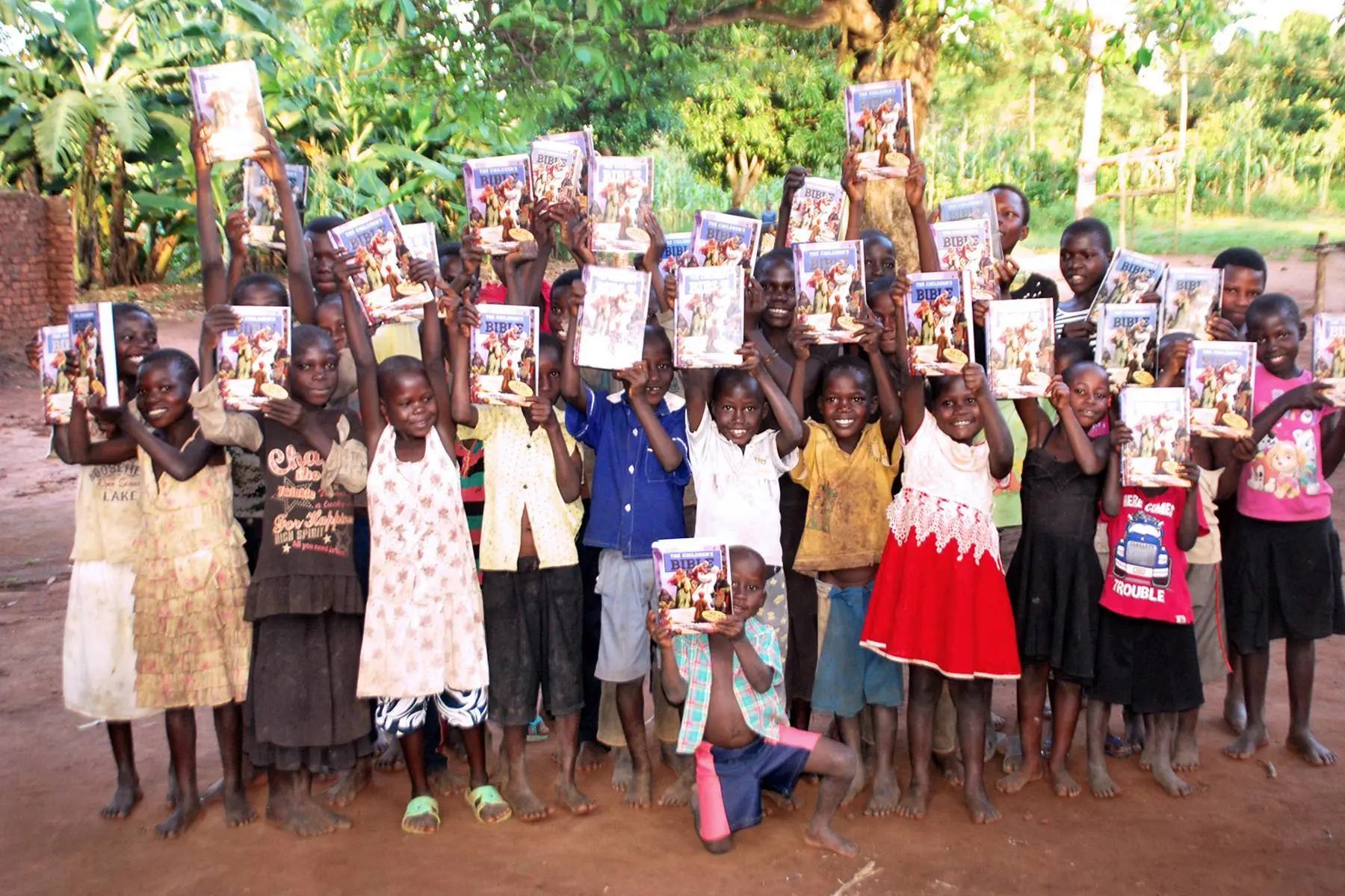 Children holding new Bibles