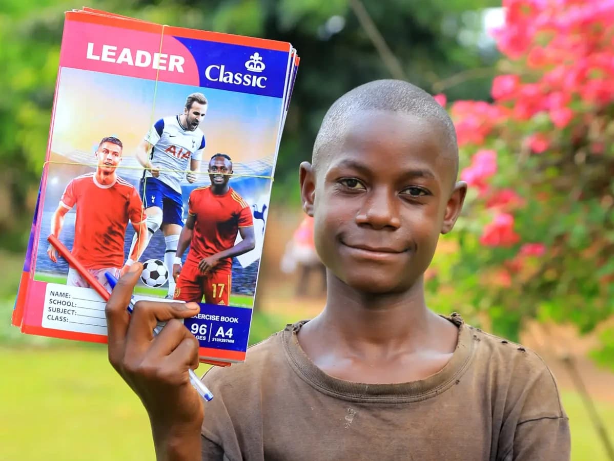 Esau balancing books and a soccer ball