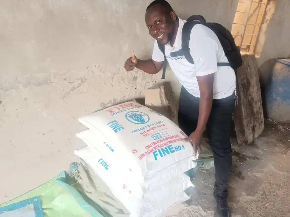Pastor Brian holding harvested corn