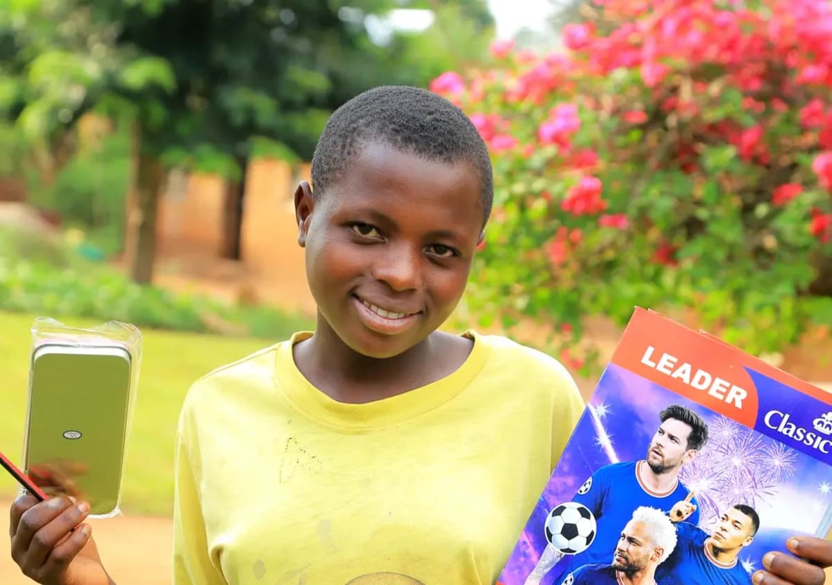 Sarah displaying notebooks and pens